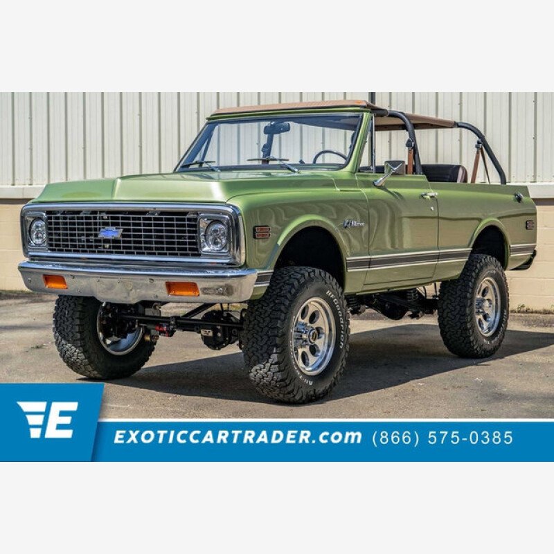 1969 Chevrolet Blazer naranja y blanco brillante con bote y remolque 1969 Chevrolet Blazer naranja y blanco brillante con bote y remolque